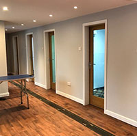 The bright interior corridor of the kennel block